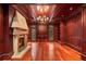 Elegant home office featuring wood paneling, a fireplace, and custom built-ins at 760 River Gate Dr, Atlanta, GA 30350