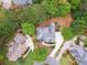 Aerial view of well-maintained home with circular driveway and landscaped yard at 151 Overhill Point, Alpharetta, GA 30005
