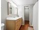 Updated bathroom with a modern vanity, decorative mirror, and separate shower with a shower curtain at 151 Overhill Point, Alpharetta, GA 30005