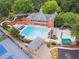 View of community pool and recreation area, complete with seating and umbrellas at 151 Overhill Point, Alpharetta, GA 30005