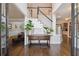 Elegant foyer with hardwood floors, staircase, and stylish decor elements at 151 Overhill Point, Alpharetta, GA 30005