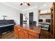 Spacious home office featuring a grand desk, piano, and built-in shelving at 151 Overhill Point, Alpharetta, GA 30005