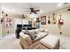 Entertaining home theater with comfortable seating, ceiling fan, mounted guitars, and a projector setup at 151 Overhill Point, Alpharetta, GA 30005