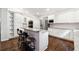 Gourmet kitchen featuring granite countertops, island seating, and stainless steel appliances at 151 Overhill Point, Alpharetta, GA 30005
