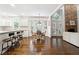 Open kitchen and dining area featuring a breakfast bar, granite countertops, and natural light at 151 Overhill Point, Alpharetta, GA 30005