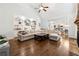 Open concept living room features built-in bookshelves and seamlessly connects to the kitchen at 151 Overhill Point, Alpharetta, GA 30005