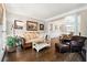 Spacious living room boasts hardwood floors, elegant trim, and plenty of natural light with views to dining room at 151 Overhill Point, Alpharetta, GA 30005