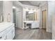 Bright main bathroom with double vanity, a makeup station, and marble walk-in shower at 151 Overhill Point, Alpharetta, GA 30005
