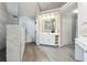 Bright main bathroom featuring double vanity, a makeup station, and a marble walk-in shower at 151 Overhill Point, Alpharetta, GA 30005