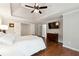 Serene main bedroom featuring a tray ceiling, hardwood floors, and access to the ensuite at 151 Overhill Point, Alpharetta, GA 30005
