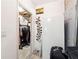 Functional storage area with a refrigerator, shelving, and ample space for belongings at 151 Overhill Point, Alpharetta, GA 30005