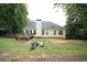 Expansive backyard featuring a wooden deck and an outdoor seating area with a fire pit at 262 Devynwood Ln, Dallas, GA 30157