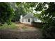 View of the backyard featuring a deck and wooden privacy fence surrounding the property at 262 Devynwood Ln, Dallas, GA 30157