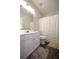 Bathroom with vanity and toilet, featuring wood-look flooring at 262 Devynwood Ln, Dallas, GA 30157