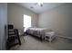 Neutral bedroom with ample natural light and a ceiling fan at 262 Devynwood Ln, Dallas, GA 30157