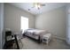 Cozy bedroom featuring neutral walls and carpet, a ceiling fan, and a desk with a modern chair at 262 Devynwood Ln, Dallas, GA 30157