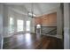 Spacious dining room with wainscoting, lots of light, hardwood floors and a modern chandelier at 262 Devynwood Ln, Dallas, GA 30157