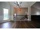 Dining room featuring hardwood floors, wainscoting, and view of the upstairs landing at 262 Devynwood Ln, Dallas, GA 30157