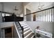 Welcoming entryway features a staircase with black iron railings, a console table with decor and a view into the living room at 262 Devynwood Ln, Dallas, GA 30157