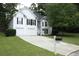 Inviting two-story home with a well-kept lawn, mailbox, and an attached two-car garage at 262 Devynwood Ln, Dallas, GA 30157