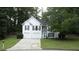Charming two-story home with a manicured lawn and a welcoming facade, enhanced by mature trees at 262 Devynwood Ln, Dallas, GA 30157