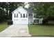 Charming two-story home with a well-manicured lawn and an inviting facade with a two-car garage at 262 Devynwood Ln, Dallas, GA 30157