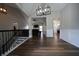 Inviting foyer with hardwood floors and a view into the living spaces at 262 Devynwood Ln, Dallas, GA 30157