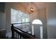 Home foyer showcasing stairway, chandelier, and hardwood floors at 262 Devynwood Ln, Dallas, GA 30157
