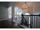 Home foyer showcasing stairway, chandelier, and hardwood floors at 262 Devynwood Ln, Dallas, GA 30157