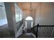 Home foyer showcasing stairway and chandelier, and hardwood floors at 262 Devynwood Ln, Dallas, GA 30157
