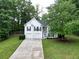 Inviting two-story home with a manicured lawn, attached two-car garage, and covered entryway at 262 Devynwood Ln, Dallas, GA 30157