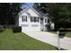 Charming two-story home featuring white siding, black shutters and a two car garage at 262 Devynwood Ln, Dallas, GA 30157