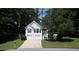 Charming two-story home featuring white siding, black shutters and a two car garage at 262 Devynwood Ln, Dallas, GA 30157