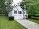 Charming two-story home featuring white siding, black shutters and a two car garage at 262 Devynwood Ln, Dallas, GA 30157