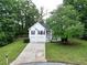 Charming two-story home featuring white siding, black shutters and a two car garage at 262 Devynwood Ln, Dallas, GA 30157