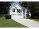 Charming two-story home featuring white siding, black shutters and a two car garage at 262 Devynwood Ln, Dallas, GA 30157
