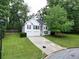 Charming two-story home featuring white siding, black shutters and a two car garage at 262 Devynwood Ln, Dallas, GA 30157