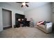Well-lit home office featuring a ceiling fan, a comfortable chair, and a built-in desk with dual monitors at 262 Devynwood Ln, Dallas, GA 30157