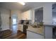 Modern kitchen featuring granite countertops, stainless steel appliances, and white subway tile backsplash at 262 Devynwood Ln, Dallas, GA 30157