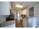 Galley kitchen with white cabinetry, stainless steel appliances, and granite countertops at 262 Devynwood Ln, Dallas, GA 30157