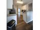 Galley kitchen with white cabinetry, stainless steel appliances, and granite countertops at 262 Devynwood Ln, Dallas, GA 30157