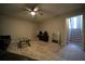 Relaxing living room features neutral carpet, ceiling fan and stairway to upper level at 262 Devynwood Ln, Dallas, GA 30157