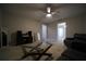 Bright living room with neutral carpet, ceiling fan, glass table and comfortable sofas at 262 Devynwood Ln, Dallas, GA 30157
