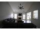 Spacious living room with fireplace, ceiling fan, hardwood floors and open concept to dining area at 262 Devynwood Ln, Dallas, GA 30157