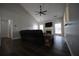 Living room featuring vaulted ceiling, fan, fireplace, and modern floors at 262 Devynwood Ln, Dallas, GA 30157