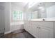 Main bathroom featuring double sinks, large soaking tub and walk-in shower at 262 Devynwood Ln, Dallas, GA 30157