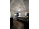 Spacious main bedroom features a tray ceiling, fan, and hardwood floors at 262 Devynwood Ln, Dallas, GA 30157