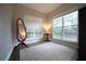 Sitting area with hardwood floors and natural light from the two large windows at 262 Devynwood Ln, Dallas, GA 30157