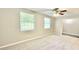 Spacious bedroom featuring new carpet, neutral paint, a ceiling fan, and natural light at 4363 Stonewall Tell Rd, Atlanta, GA 30349