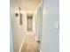 Clean hallway with new carpeting offering access to multiple rooms and closet space at 4363 Stonewall Tell Rd, Atlanta, GA 30349